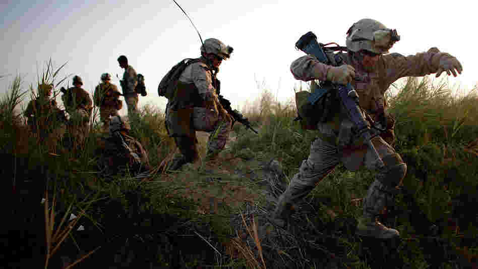Lance Cpl. Chris Garcia crosses an irrigation ditch in Afghanistan. Lance Cpl. Chris Garcia crosses an irrigation ditch in Afghanistan.