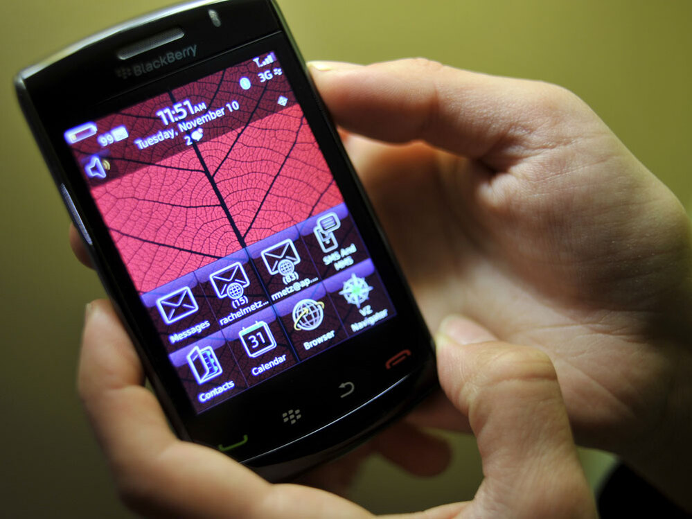 A person handles the new BlackBerry Storm2