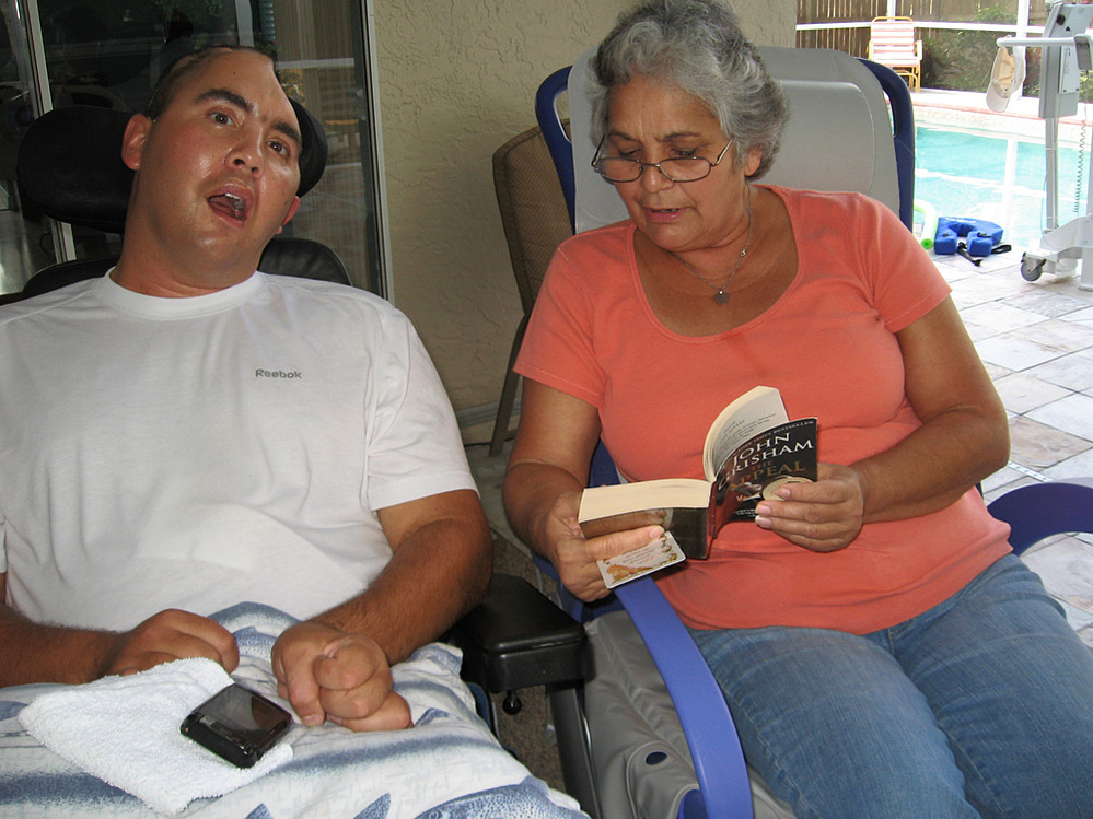 Nellie Bagley reads to her son, Jose, who was wounded in Iraq.