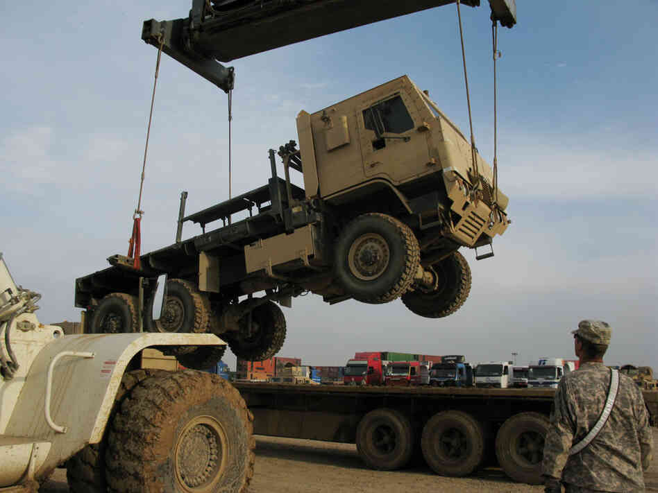 Armored transport truck loaded onto a flatbed in Balad, Iraq