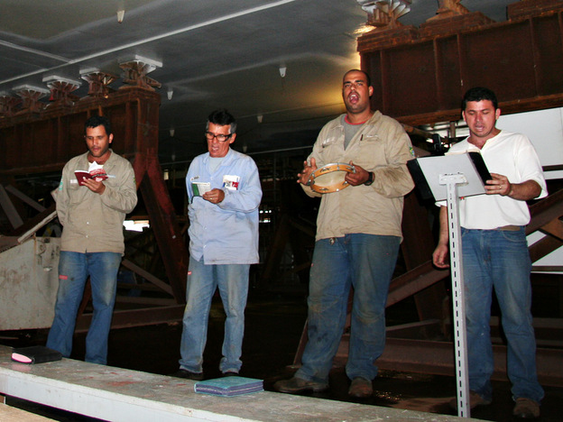 Workers at the Angra shipyard take time during a mid-day break to pray.