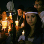 Richmond High School students hold candles during a vigil to support the victim of a brutal rape. Richmond High School students hold candles during a vigil to support the victim of a brutal rape.
