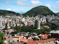 Santa Marta, shown in the foreground, is one of Rio de Janeiro's most notorious slums. Officials are trying to stem crime and violence there through a community-based approach to policing.