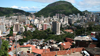 Santa Marta, shown in the foreground, is one of Rio de Janeiro's most notorious slums. Officials are trying to stem crime and violence there through a community-based approach to policing.