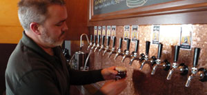 Kevin DeLange, the owner of Dry Dock Brewery, a craft beer maker in Aurora, Colo., says business has soared since he bought a sixth fermenter to brew beer. Credit: Kirk Siegler for NPR