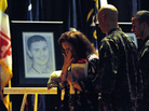 Family and Marines pass the line of portraits. Jeff Janowski for NPR Family and Marines pass the line of portraits. Jeff Janowski for NPR