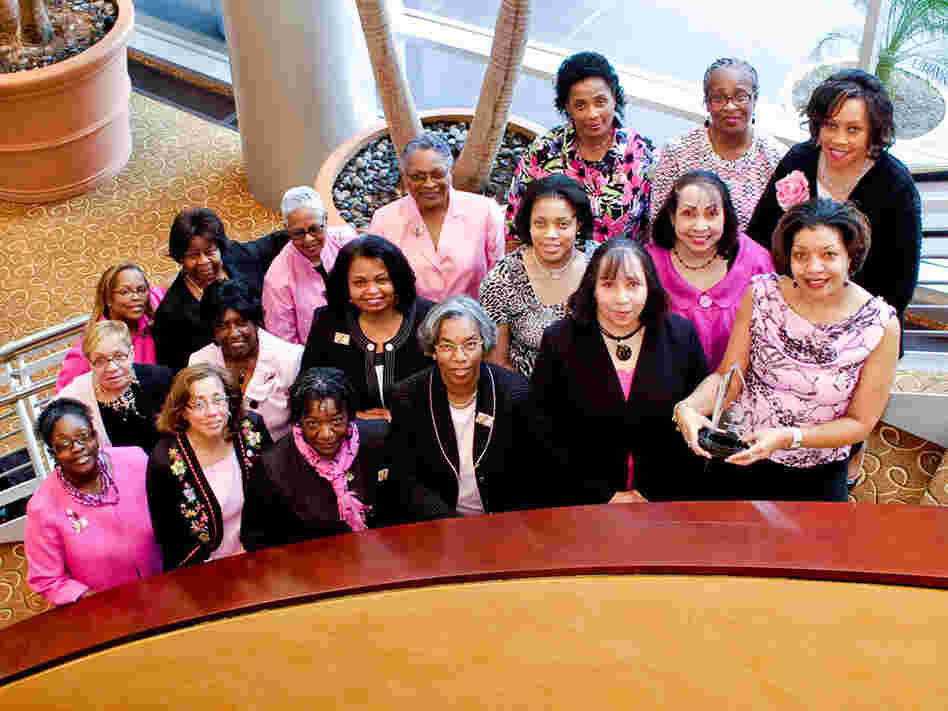 A group of African-American breast cancer survivors pose at an annual survivors'  event.