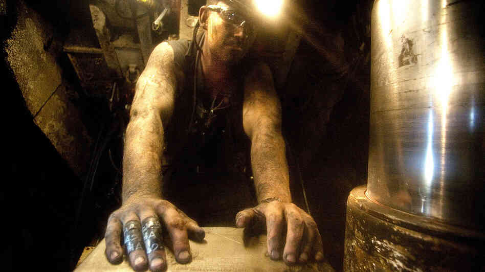 Mike Snyder of Delta, Colo., works as a long-wall shield puller in a coal mine near Somerset, Colo. Mike Snyder of Delta, Colo., works as a long-wall shield puller in a coal mine near Somerset, Colo.