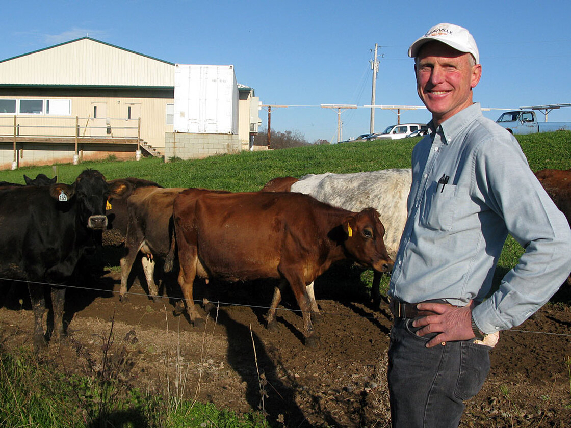 Warren Taylor with cows on the farm that provides milk to Snowville Creamery, in Pomeroy, Ohio.