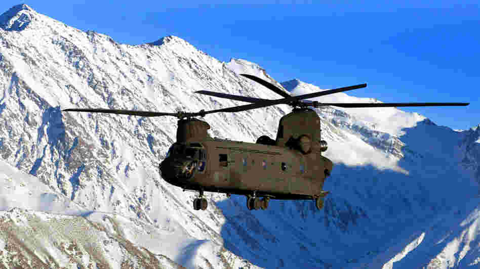W: A U.S. Army helicopter flies over the snow-capped Hindu Kush mountains of Afghanistan W: A U.S. Army helicopter flies over the snow-capped Hindu Kush mountains of Afghanistan