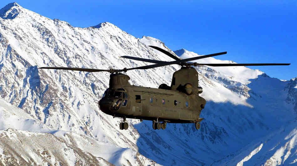 W: A U.S. Army helicopter flies over the snow-capped Hindu Kush mountains of Afghanistan W: A U.S. Army helicopter flies over the snow-capped Hindu Kush mountains of Afghanistan