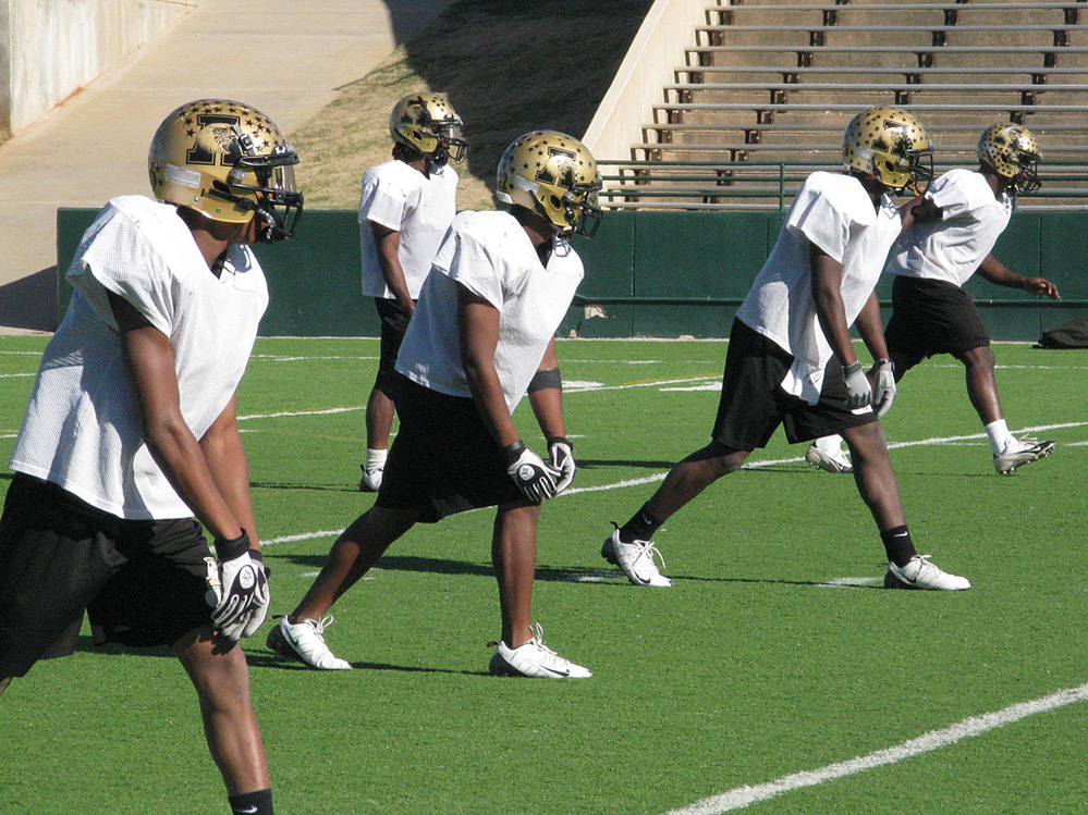 Abilene high school football players practice for the state championship game.