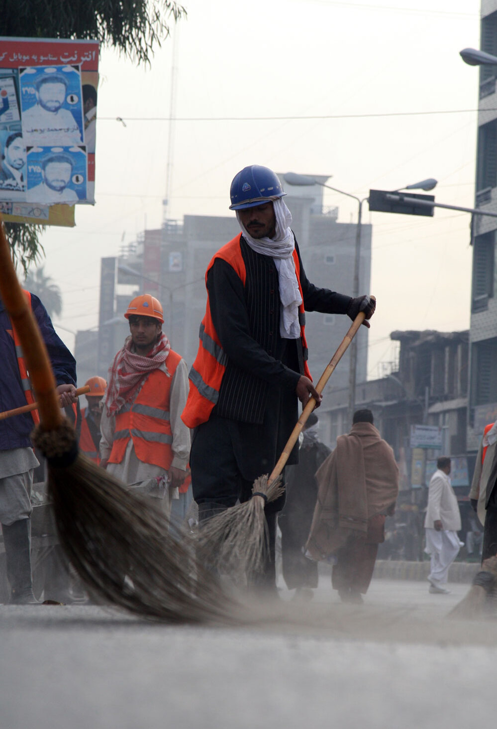 Street sweepers in the Afghan city of Jalalabad