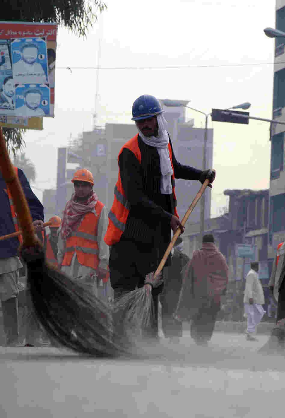 Street sweepers in the Afghan city of Jalalabad