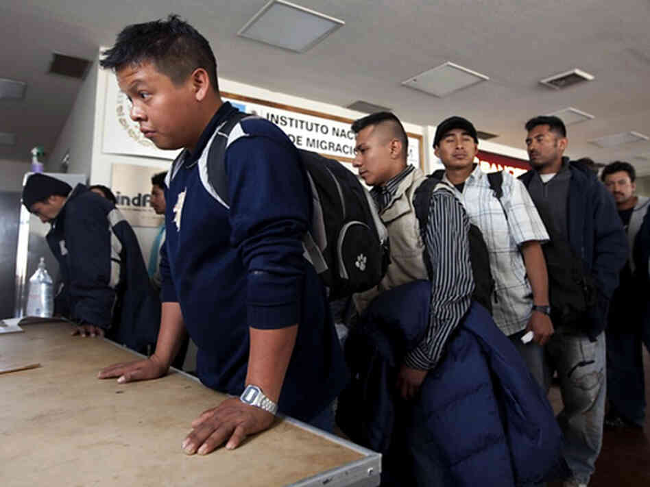 Mexican nationals line up at the immigration office in remote Ojinaga. Mexican nationals line up at the immigration office in remote Ojinaga.