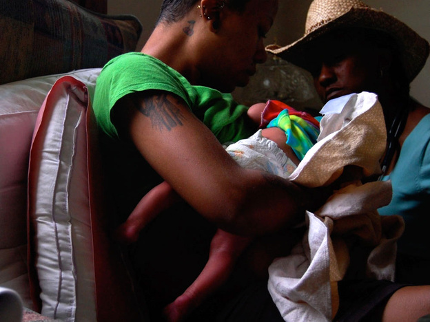 Lisa Uncles visits a new mother a day after she gave birth.