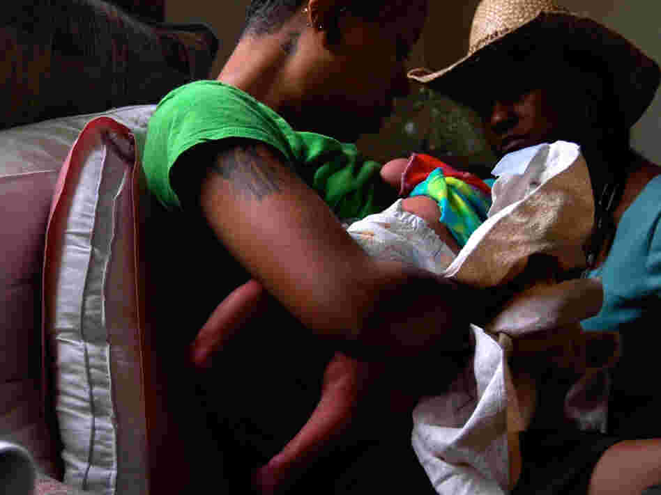 Lisa Uncles visits a new mother a day after she gave birth.