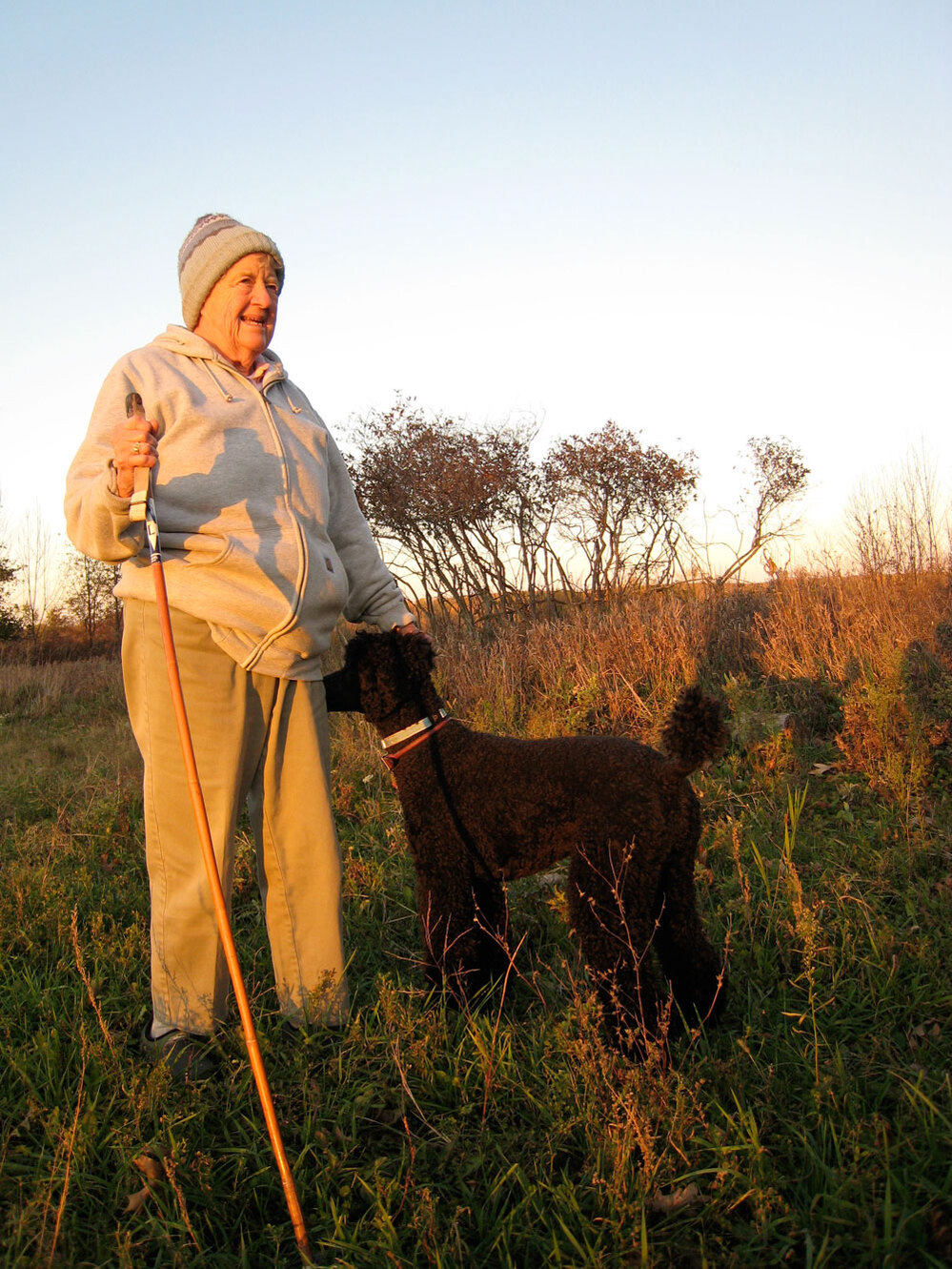Joan Graham standing at her proposed burial site on her land.