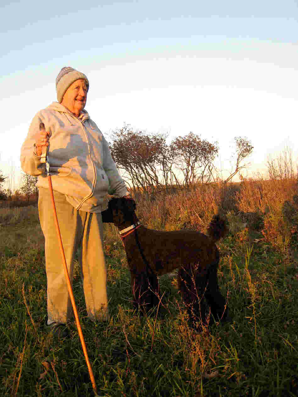 Joan Graham standing at her proposed burial site on her land.