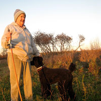 Joan Graham standing at her proposed burial site on her land.