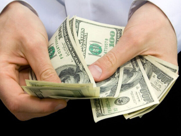 Hands counting out cash