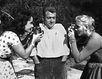 Elizabeth Taylor, Bob Willoughby and Eva Marie Saint on the set of <em>Raintree County,</em> 1957