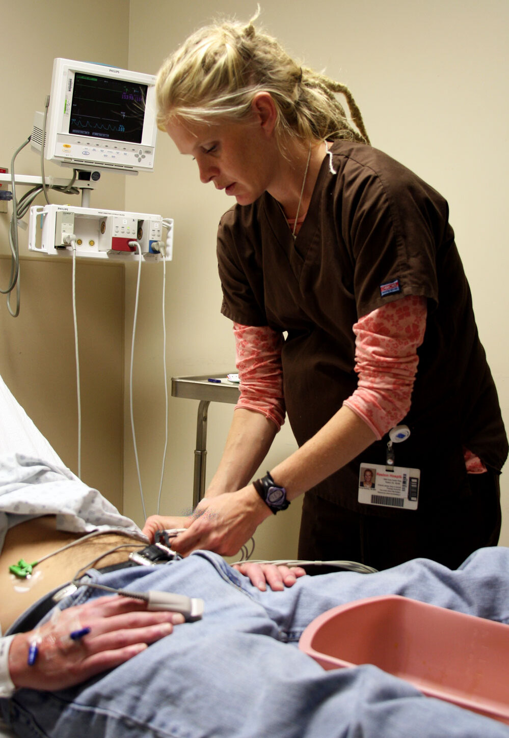 Emergency room nurse Christi Romney tends to a patient.