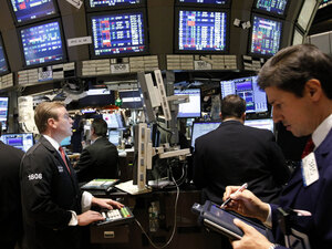 Traders watch market activity at the New York Stock Exchange on Monday. Traders watch market activity at the New York Stock Exchange on Monday.
