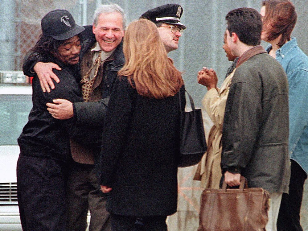 David Protess (right) and Anthony Porter  embrace outside the Cook County Jail in Chicago.