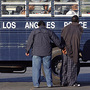 Los Angeles police and FBI agents process detained suspected gang members in October 2009. Los Angeles police and FBI agents process detained suspected gang members in October 2009.