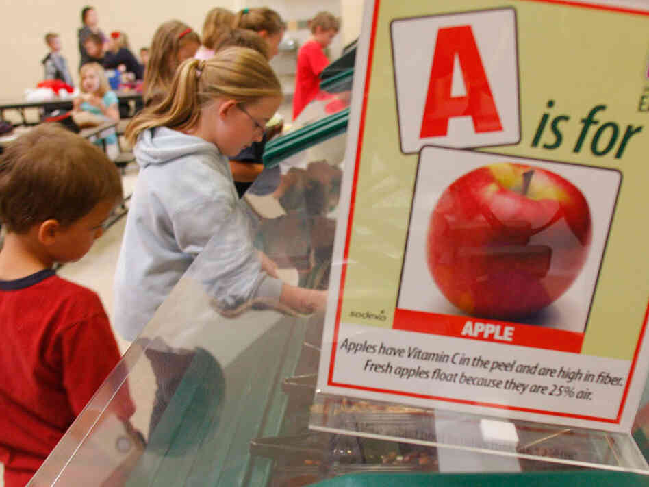Students get lunch at the salad bar as part of a health program.