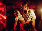 A man carries an injured child outside the Hotel Villa Creole in Port-au-Prince, Haiti A man carries an injured child outside the Hotel Villa Creole in Port-au-Prince, Haiti