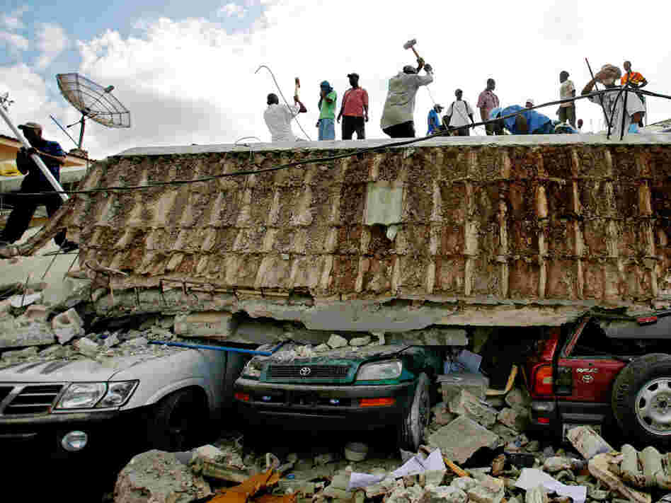 People search for survivors in the rubble in Port-au-Prince.