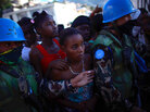 Women stand in line for food rations being handed out by the United Nations in Port-au-Prince. Women stand in line for food rations being handed out by the United Nations in Port-au-Prince.