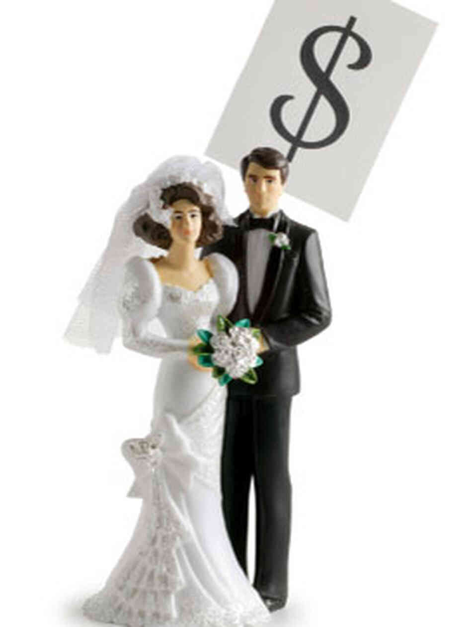 Wedding cake topper with a dollar sign Wedding cake topper with a dollar sign
