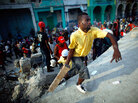 Violence erupts as Haitians loot around a collapsed grocery store Violence erupts as Haitians loot around a collapsed grocery store