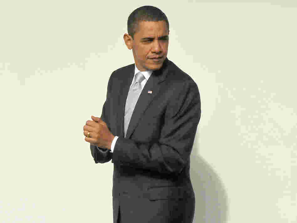 President Barack Obama walks on the colonnade toward the Oval Office.