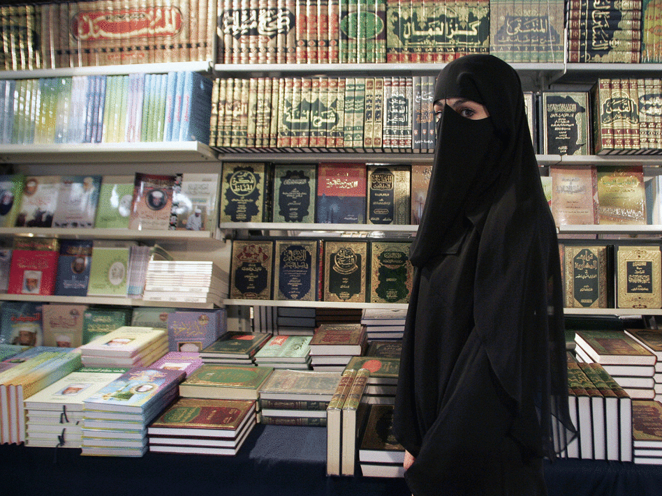 A young woman wearing a burqa near Paris, France