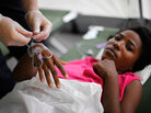 A patient in Haiti gets treatment. A patient in Haiti gets treatment.