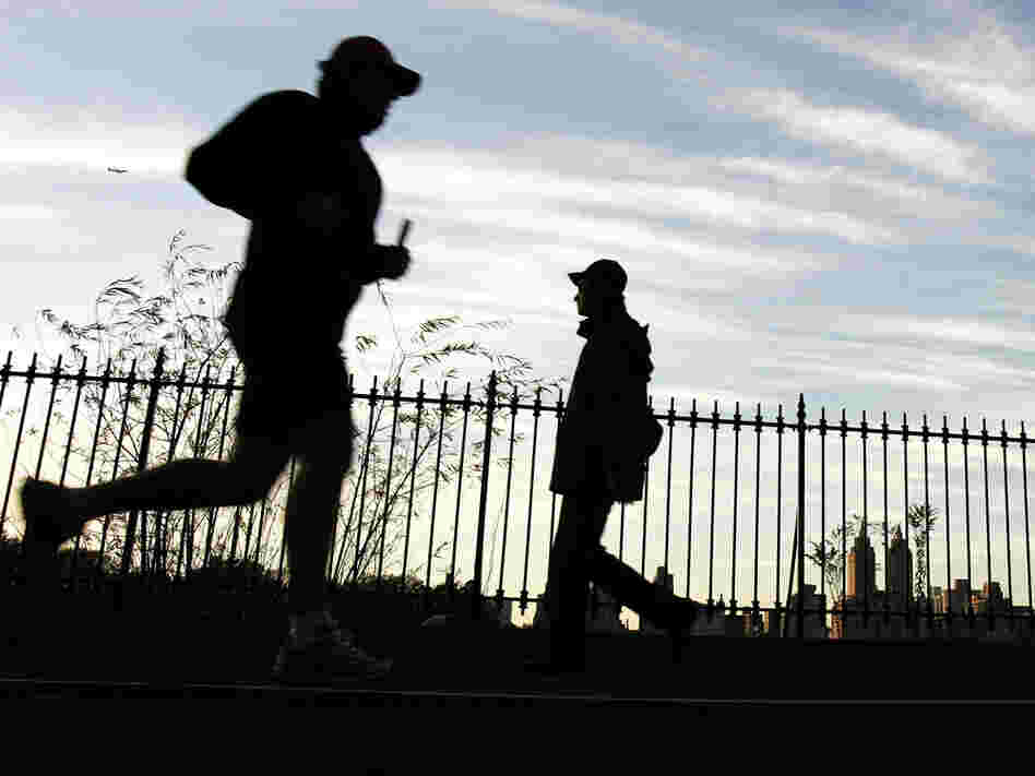 Runners take the jogging path around the Central Park reservoir