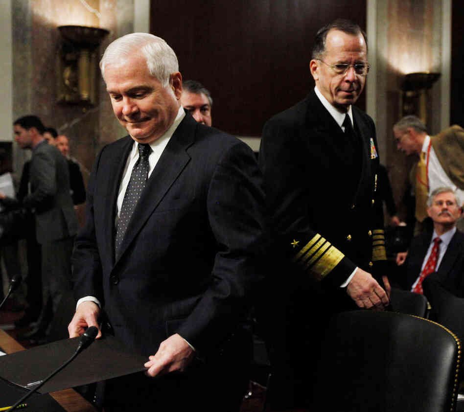 Robert Gates (left) and Michael Mullen arrive on Capitol Hill in Washington.
