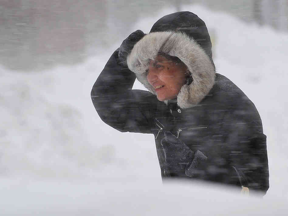 A woman struggles through a blizzard in Washington, DC