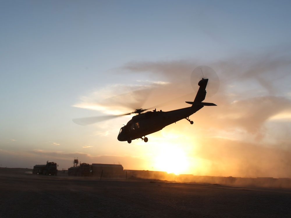 A U.S. Army Black Hawk helicopter takes off at a forward operating base in Afghanistan.