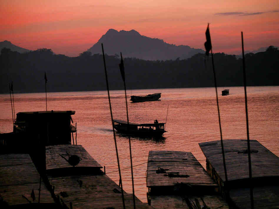 Sun sets over the Mekong River in Luang Prabang, Laos