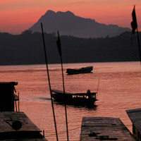 Sun sets over the Mekong River in Luang Prabang, Laos