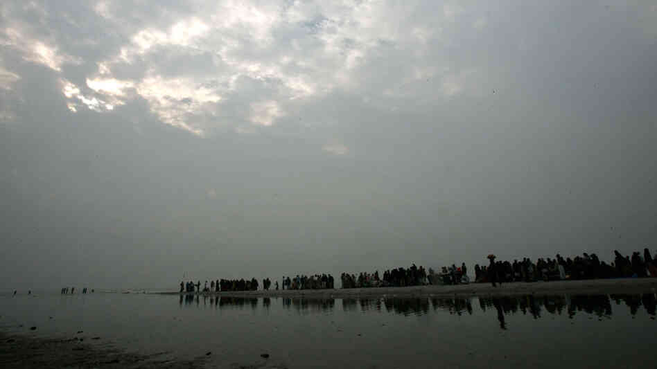 Pilgrims take a holy dip at a lagoon on Sagar Island Pilgrims take a holy dip at a lagoon on Sagar Island
