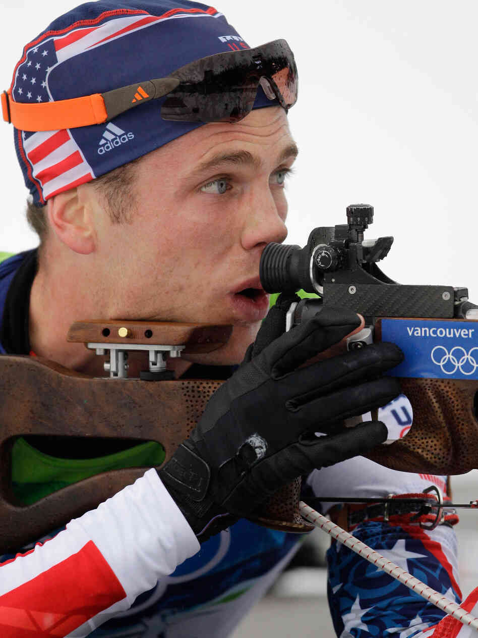 Tim Burke of the U.S. men's biathlon team aims his rifle. Tim Burke of the U.S. men's biathlon team aims his rifle.
