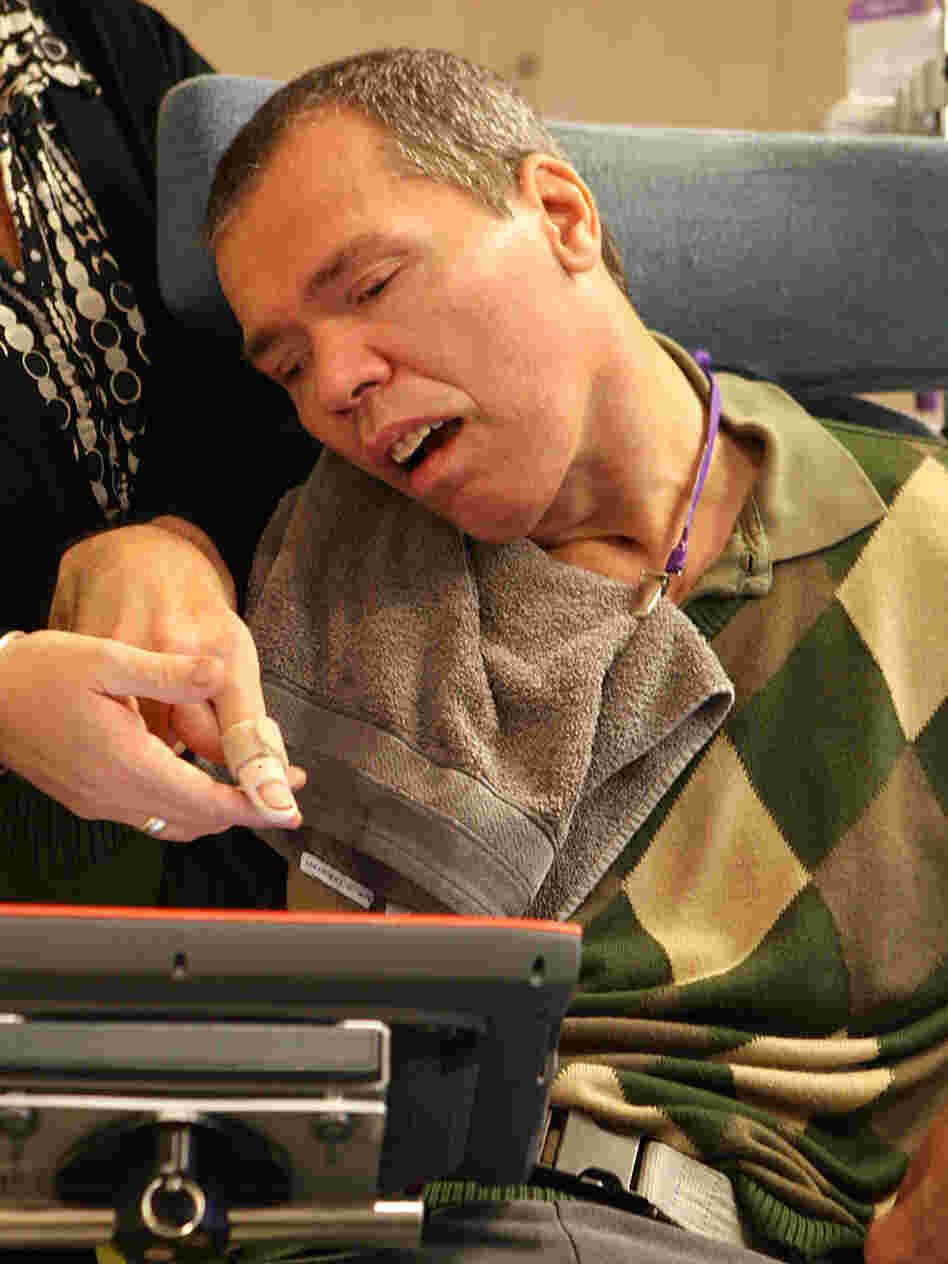 Belgium's Rom Houben appears to use a touch screen to communicate during a November 2009 interview.