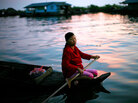 Woman in floating village on Tonle Sap Lake near Siem Reap, Cambodia Woman in floating village on Tonle Sap Lake near Siem Reap, Cambodia