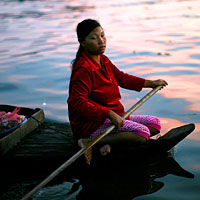 Woman in floating village on Tonle Sap Lake near Siem Reap, Cambodia